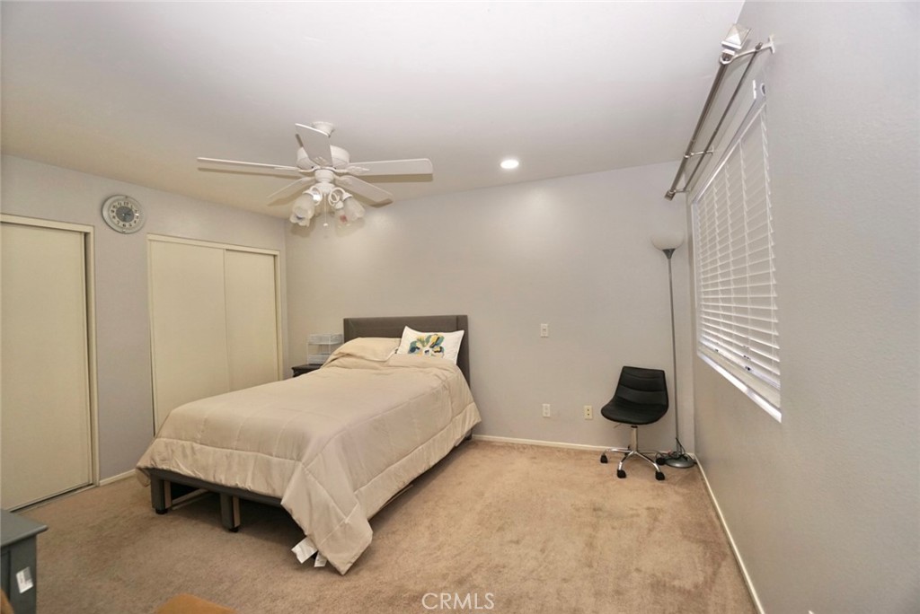 44557 La Paz Road Temecula, CA 92592 - Photo 13 of 24 a bedroom with a bed and a window