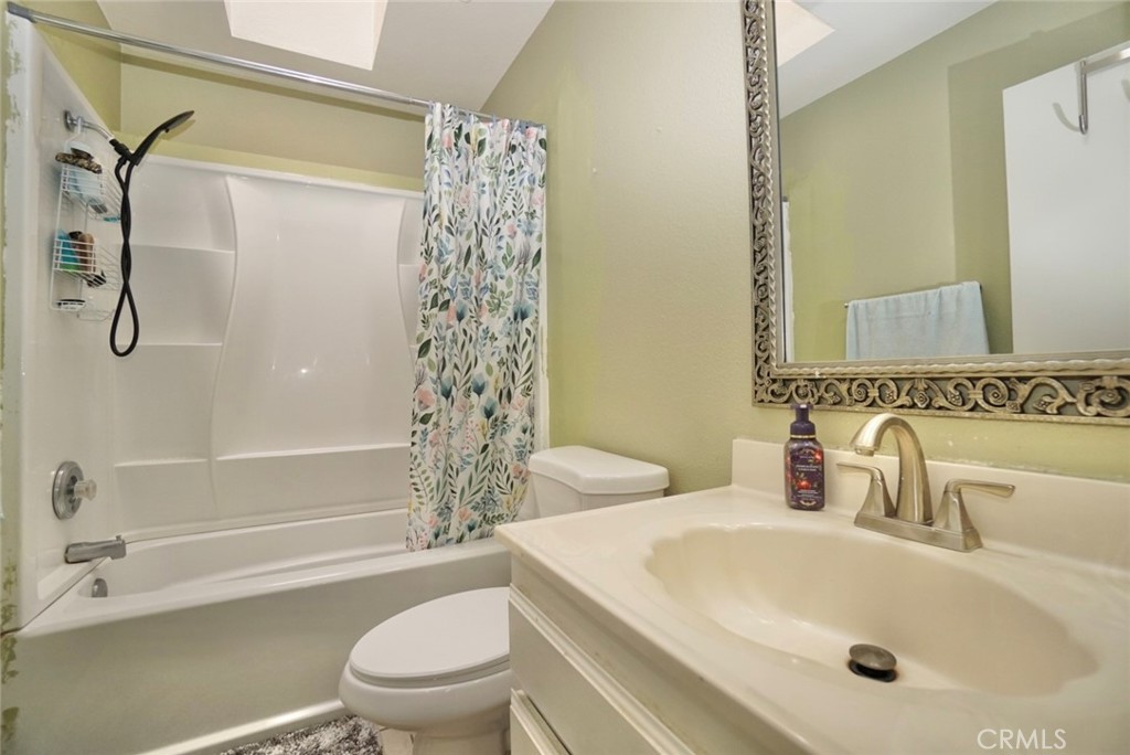 44557 La Paz Road Temecula, CA 92592 - Photo 14 of 24 a bathroom with a sink toilet and shower