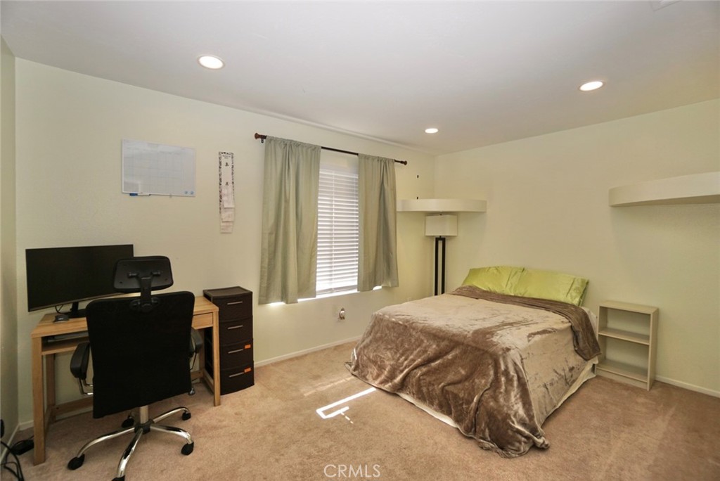 44557 La Paz Road Temecula, CA 92592 - Photo 15 of 24 a bedroom with a bed and a desk