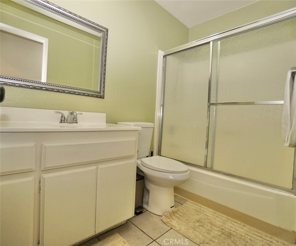 44557 La Paz Road Temecula, CA 92592 - Photo 16 of 24 a bathroom with a sink toilet and shower