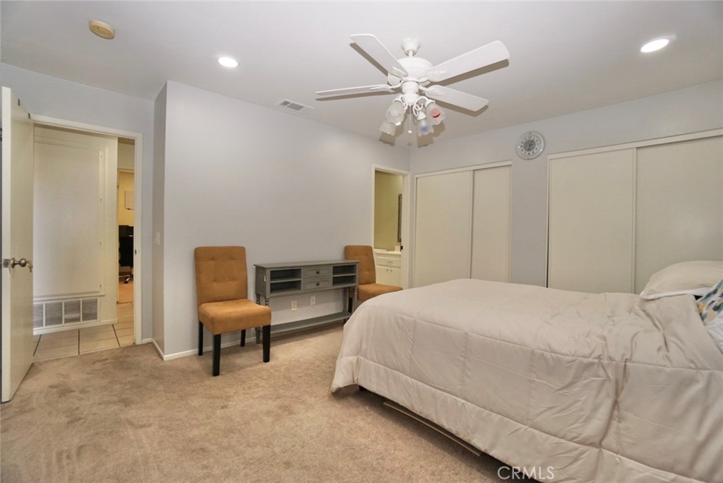 44557 La Paz Road Temecula, CA 92592 - Photo 17 of 24 a bedroom with a bed furniture and a chandelier