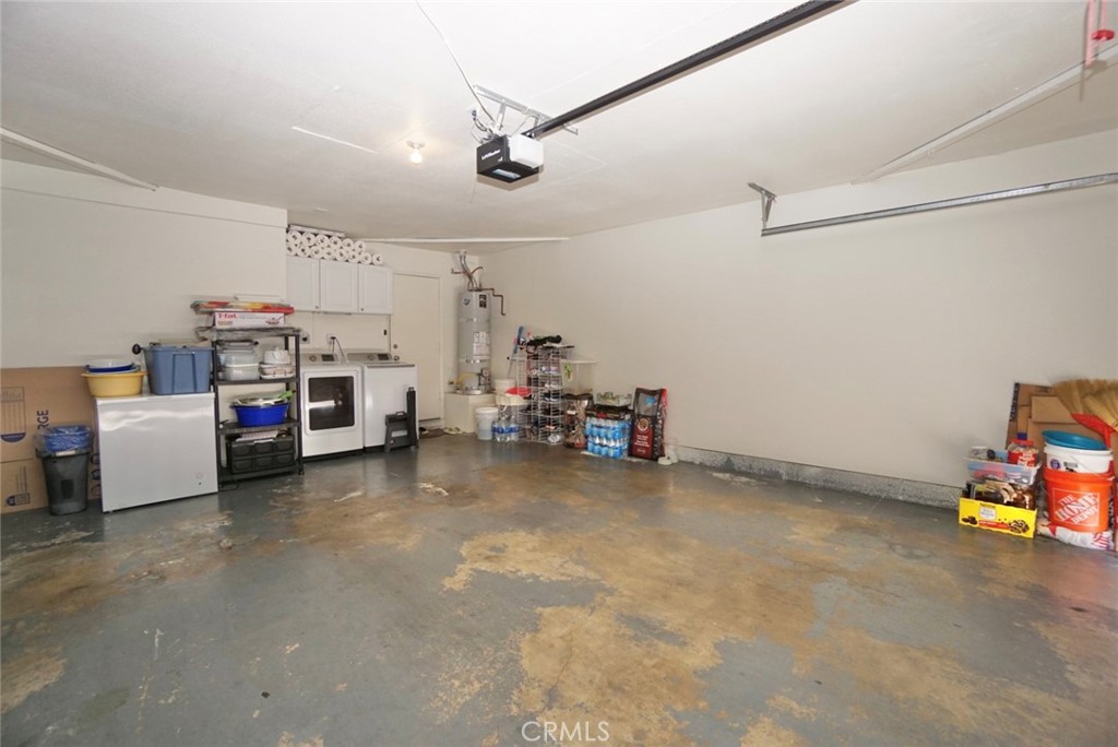 44557 La Paz Road Temecula, CA 92592 - Photo 24 of 24 a utility room with a bed and a chandelier