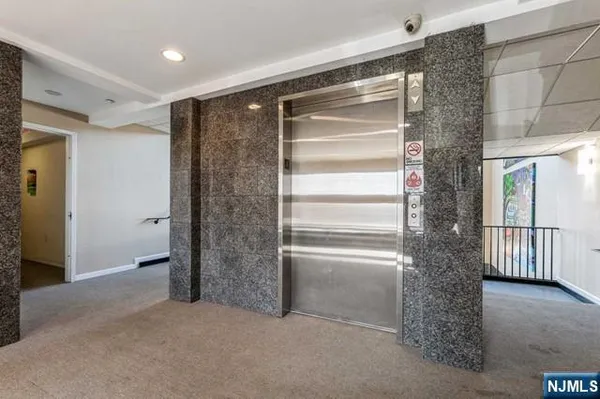 a view of an empty room with a fireplace