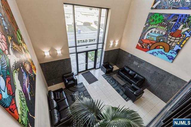 17 Meadow Road, Unit 401 Rutherford, NJ 07070 - Photo 28 of 29 a view of walk in closet with clothes and shoes