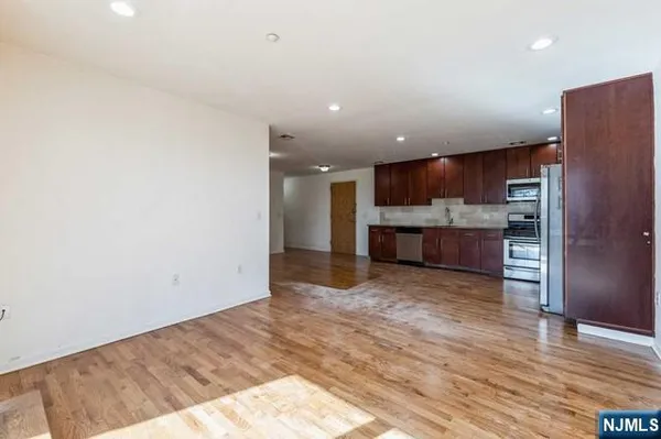 a view of kitchen with wooden floor