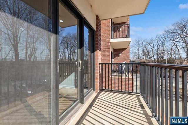 17 Meadow Road, Unit 401 Rutherford, NJ 07070 - Photo 8 of 29 a view of a balcony with a potted plant