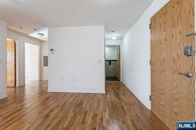 17 Meadow Road, Unit 401 Rutherford, NJ 07070 - Photo 9 of 29 a view of wooden floor in an empty room