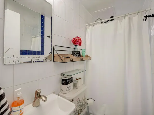 an aerial view of multiple houses with yard