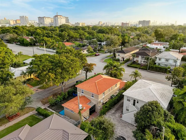 an aerial view of a house with a garden