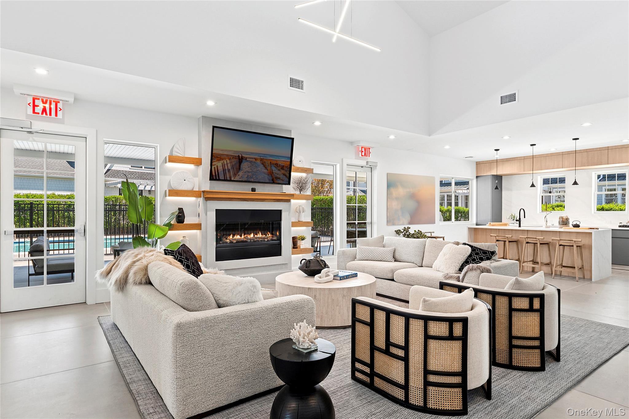 12 Depot, Unit 103 (PEARL WAY) Westhampton Beach, NY 11978 - Photo 18 of 28 a living room with furniture fireplace and a large window