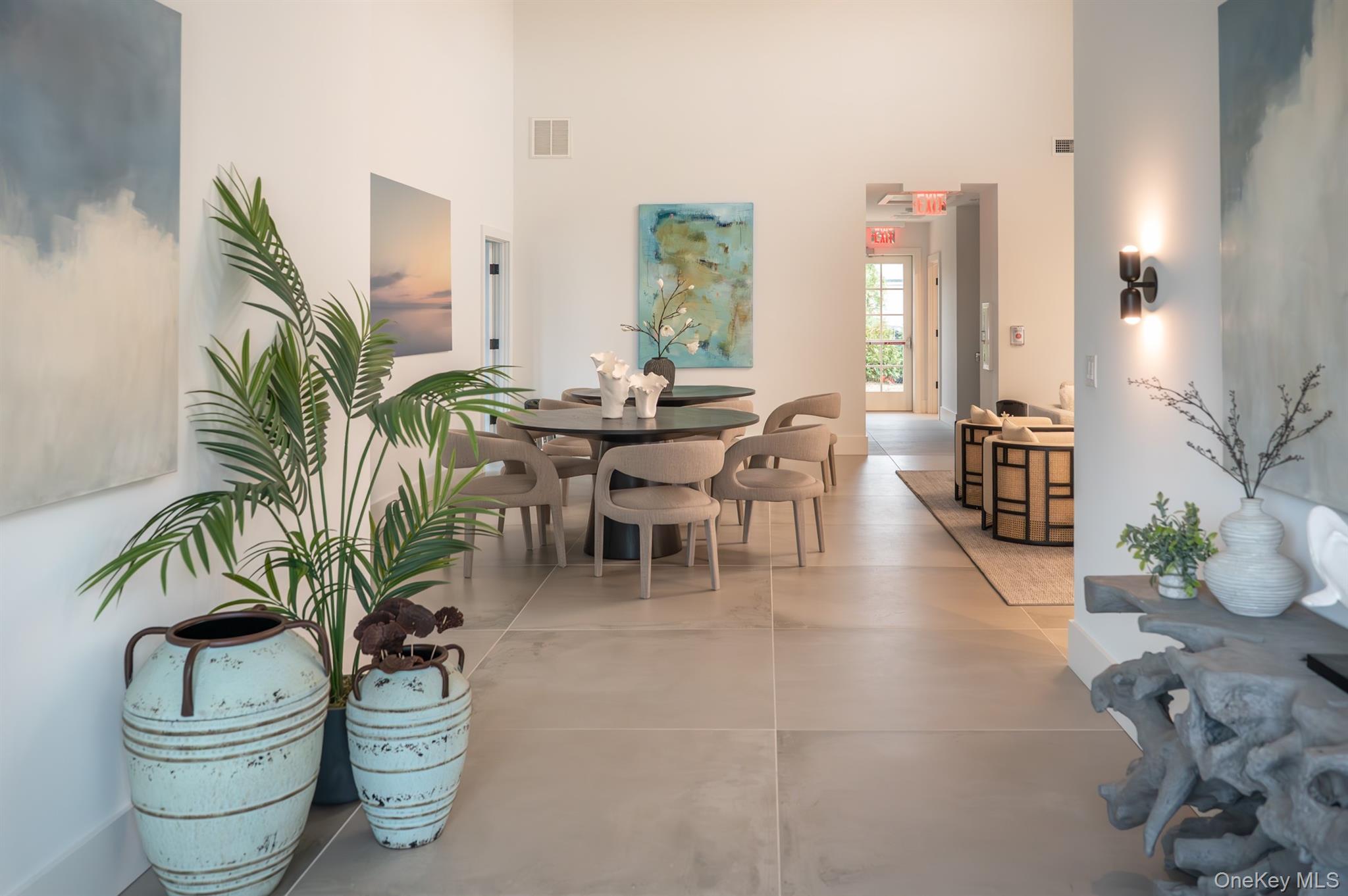 12 Depot, Unit 103 (PEARL WAY) Westhampton Beach, NY 11978 - Photo 27 of 28 a living room with furniture a potted plant and open kitchen view