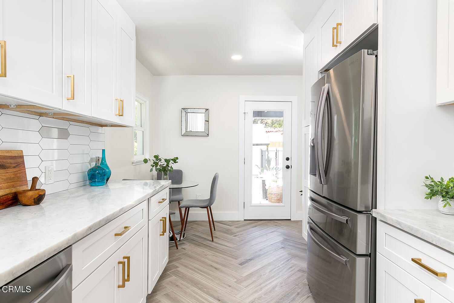 2375 Catherine Road Altadena, CA 91001 - Photo 16 of 50 a kitchen with stainless steel appliances a refrigerator sink and white cabinets