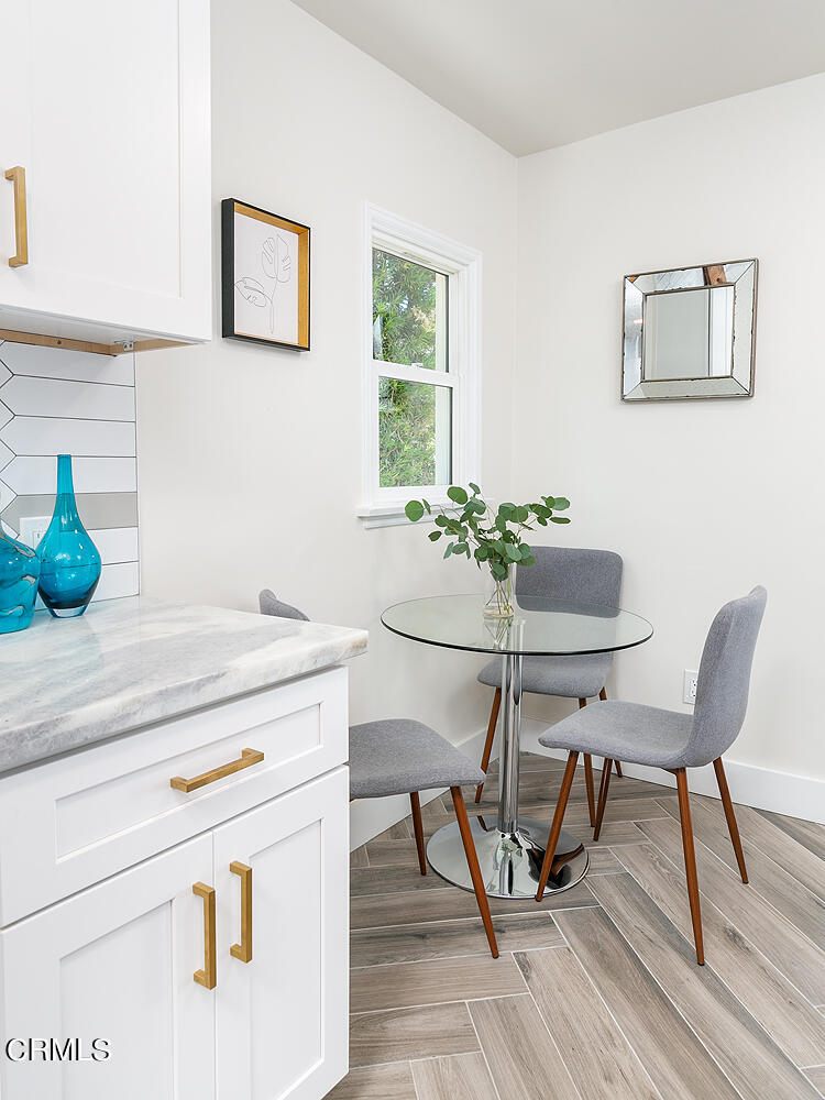 2375 Catherine Road Altadena, CA 91001 - Photo 17 of 50 a dining room table with chair and wooden floor