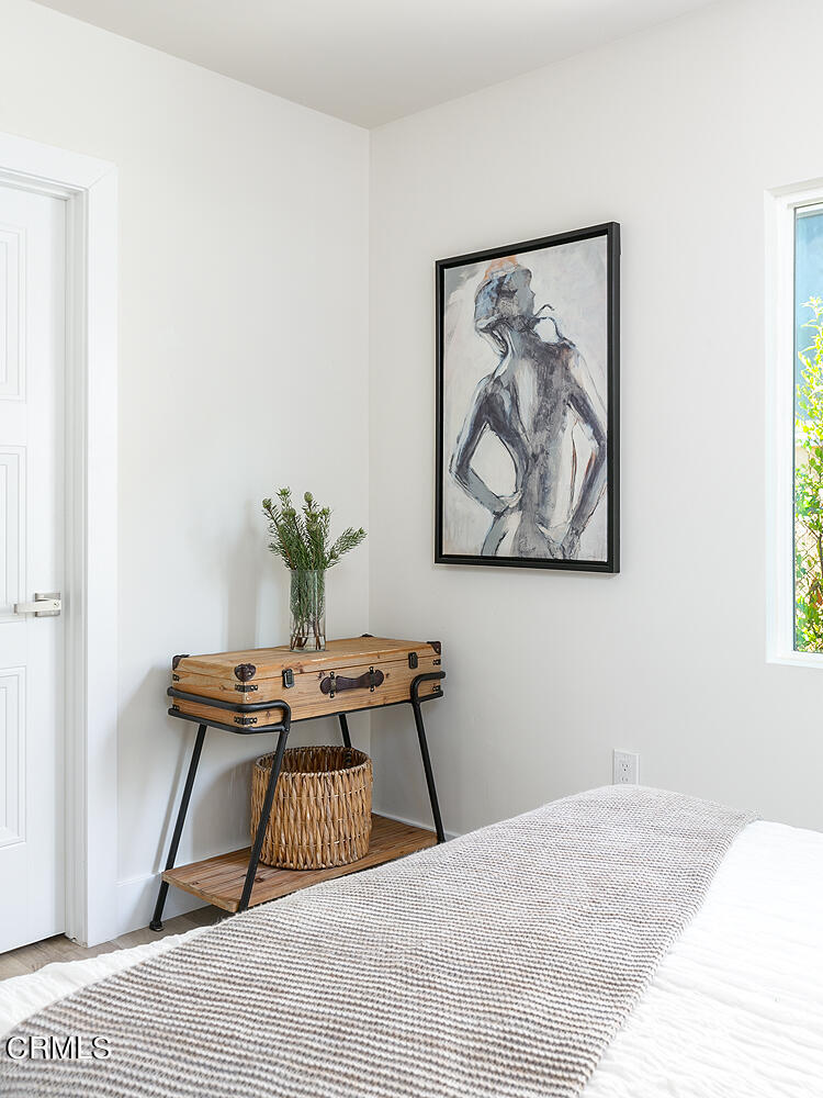 2375 Catherine Road Altadena, CA 91001 - Photo 31 of 50 a bedroom with a bed and a painting on the wall