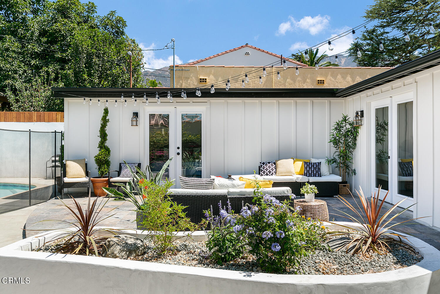 2375 Catherine Road Altadena, CA 91001 - Photo 35 of 50 a view of a patio with table and chairs potted plants