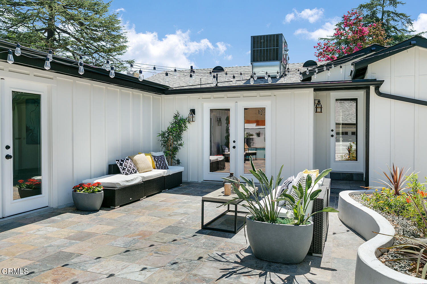 2375 Catherine Road Altadena, CA 91001 - Photo 38 of 50 a vase of flowers sitting on a table in front of a house