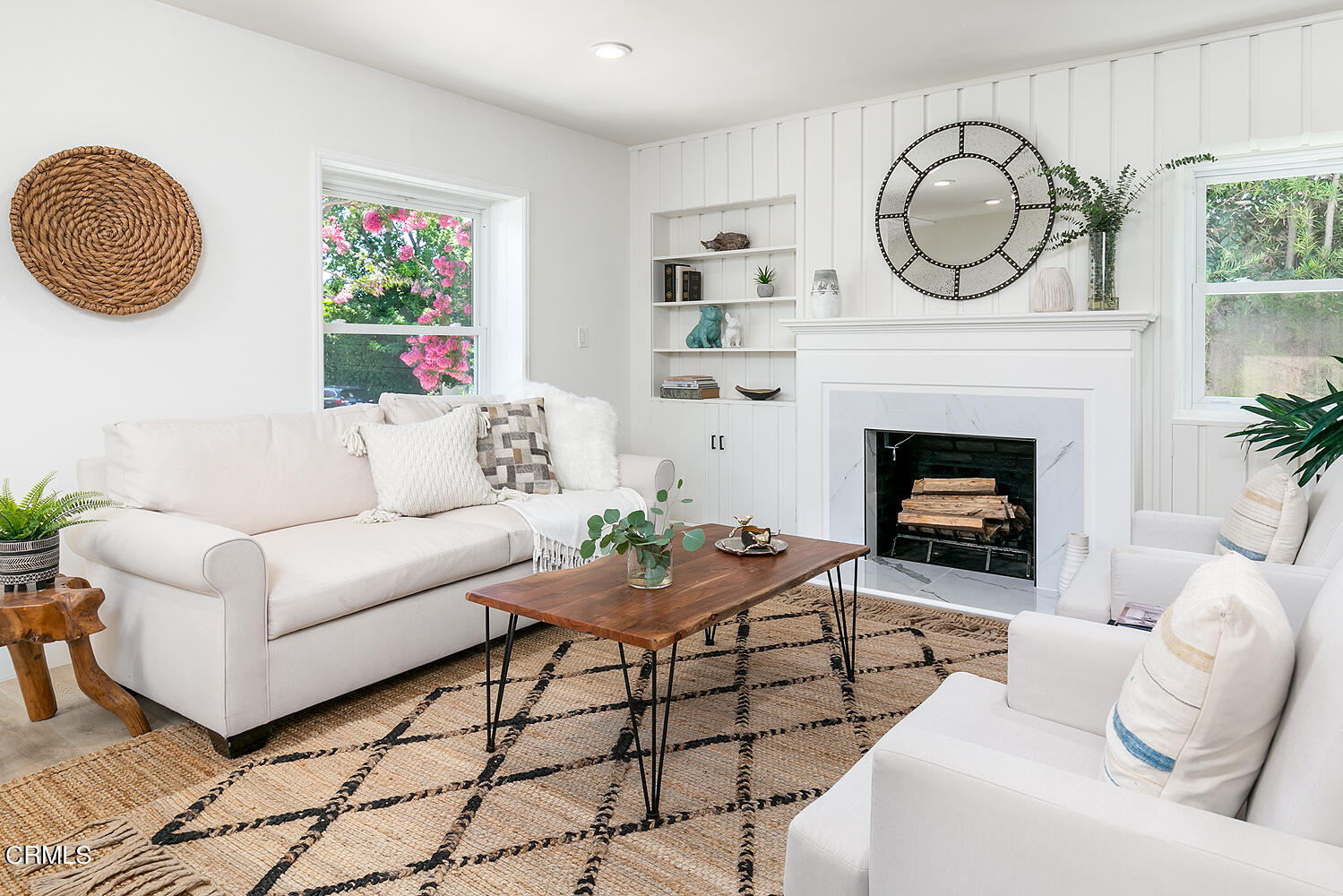 2375 Catherine Road Altadena, CA 91001 - Photo 7 of 50 a living room with furniture a clock and a fireplace