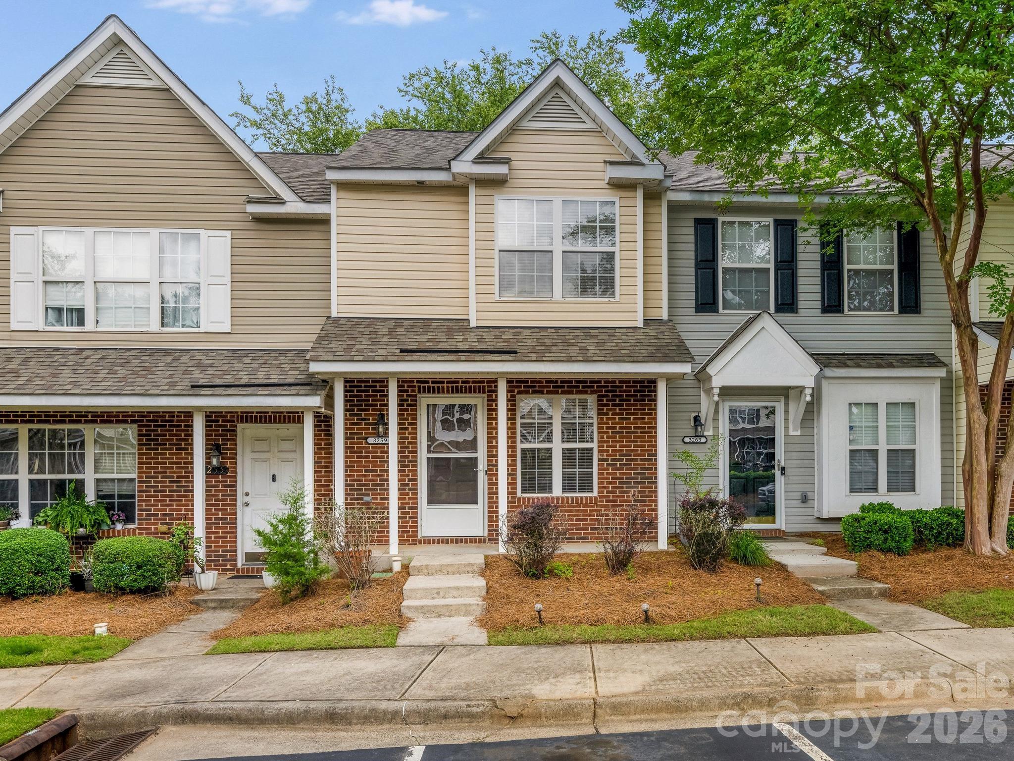 3259 Blythe Ridge Court Charlotte, NC 28213 - Photo 1 of 17 a front view of a house with yard and glass windows