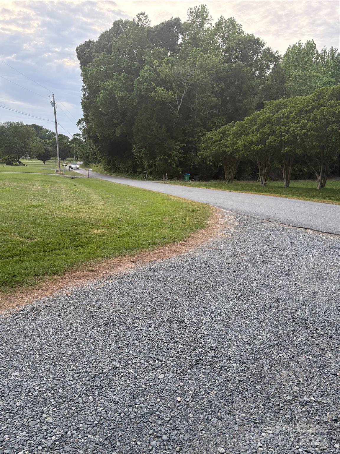 6625 Long Road Matthews, NC 28104 - Photo 2 of 23 a view of a field with trees in background