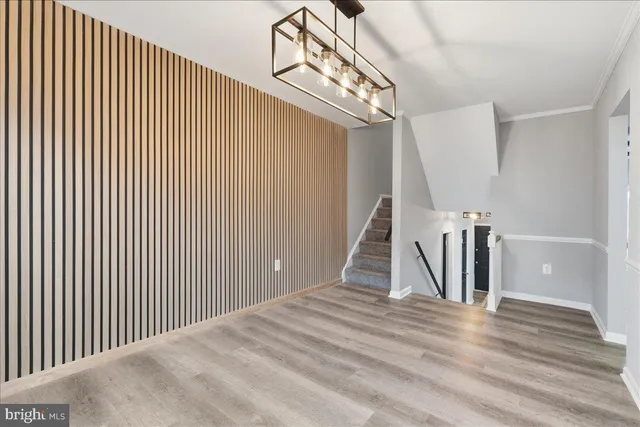 a view of a livingroom with wooden floor