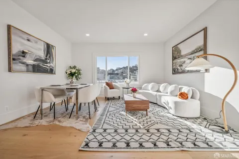a living room with furniture and a rug