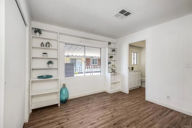 a view of a hardwood floor in a room