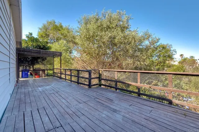 a view of a balcony with wooden floor
