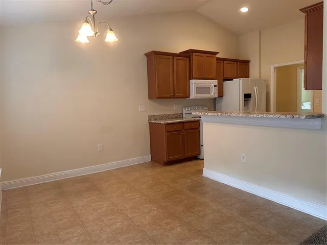 a view of living room and kitchen with flat screen tv