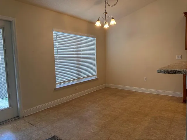 a kitchen with stainless steel appliances granite countertop a stove and a refrigerator