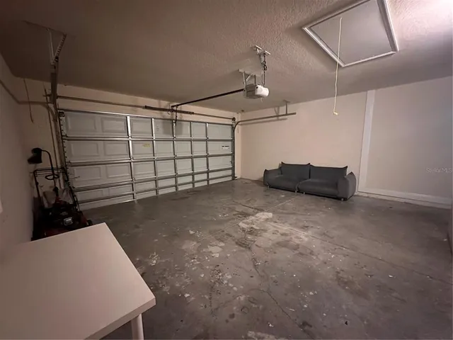 a view of a livingroom with a ceiling fan and window