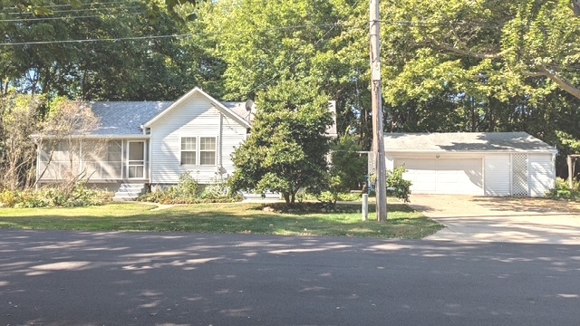 817 Chestnut Avenue Dixon, IL 61021 - Photo 1 of 31 a front view of a house with a yard and garage