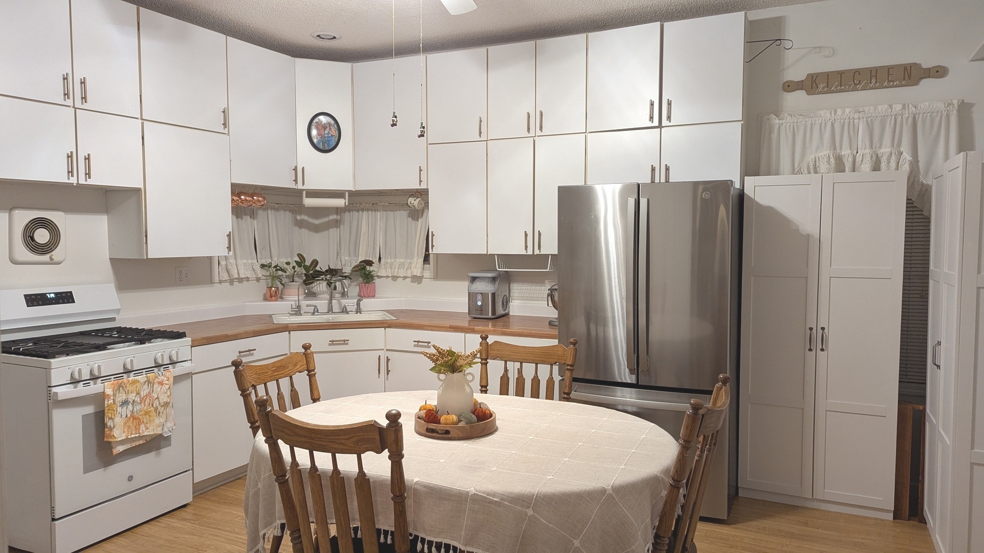 817 Chestnut Avenue Dixon, IL 61021 - Photo 11 of 31 a kitchen with stainless steel appliances granite countertop a refrigerator a sink a stove and white cabinets