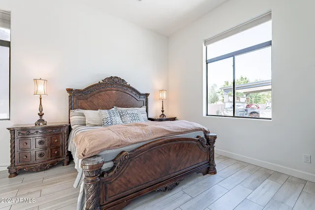 a bedroom with a bed and a window