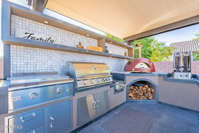 a kitchen that has a lot of cabinets in it