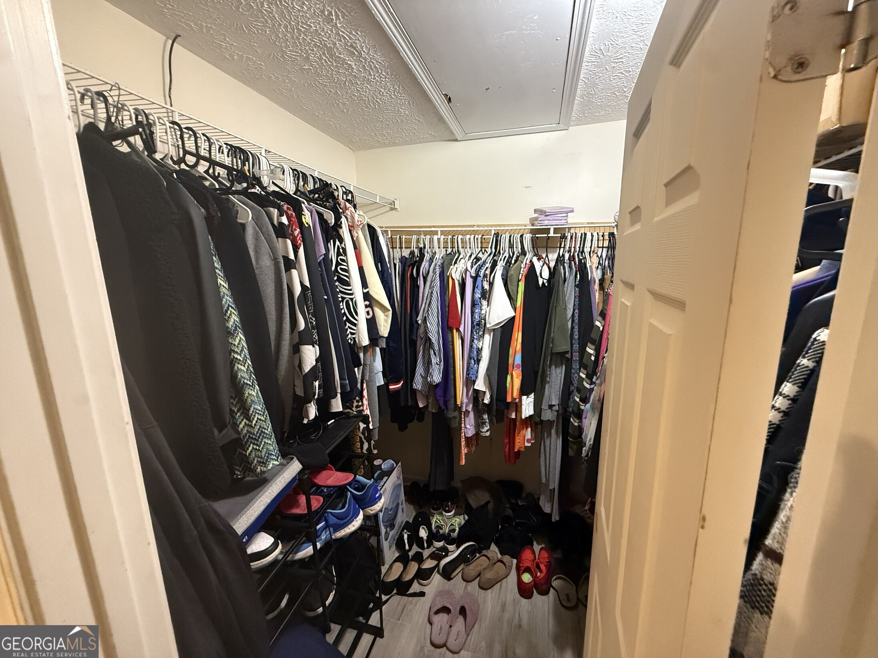 252 Sandstone Drive Hampton, GA 30228 - Photo 13 of 17 a view of walk in closet with clothes