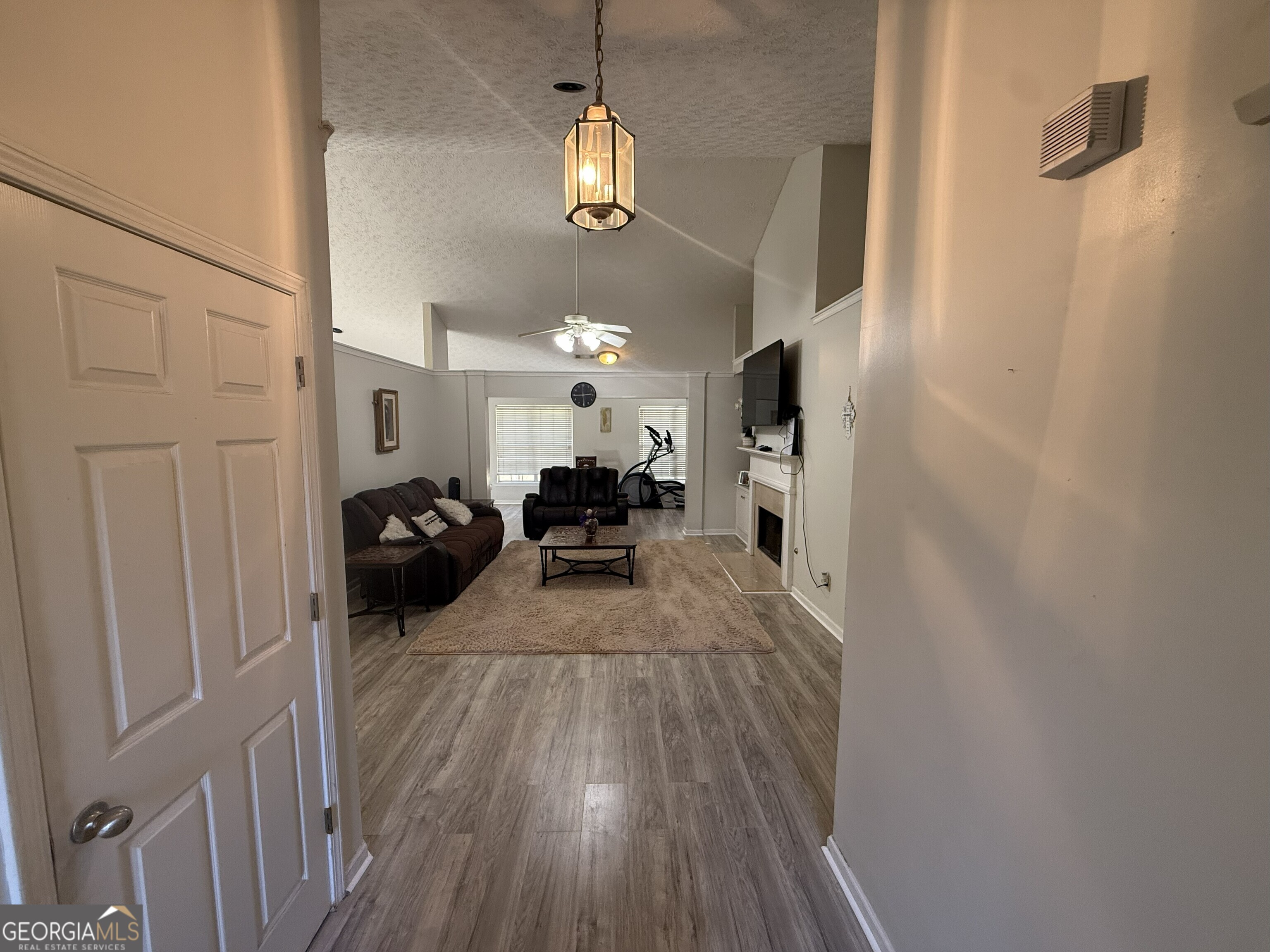 252 Sandstone Drive Hampton, GA 30228 - Photo 5 of 17 a view of living room with furniture and a chandelier