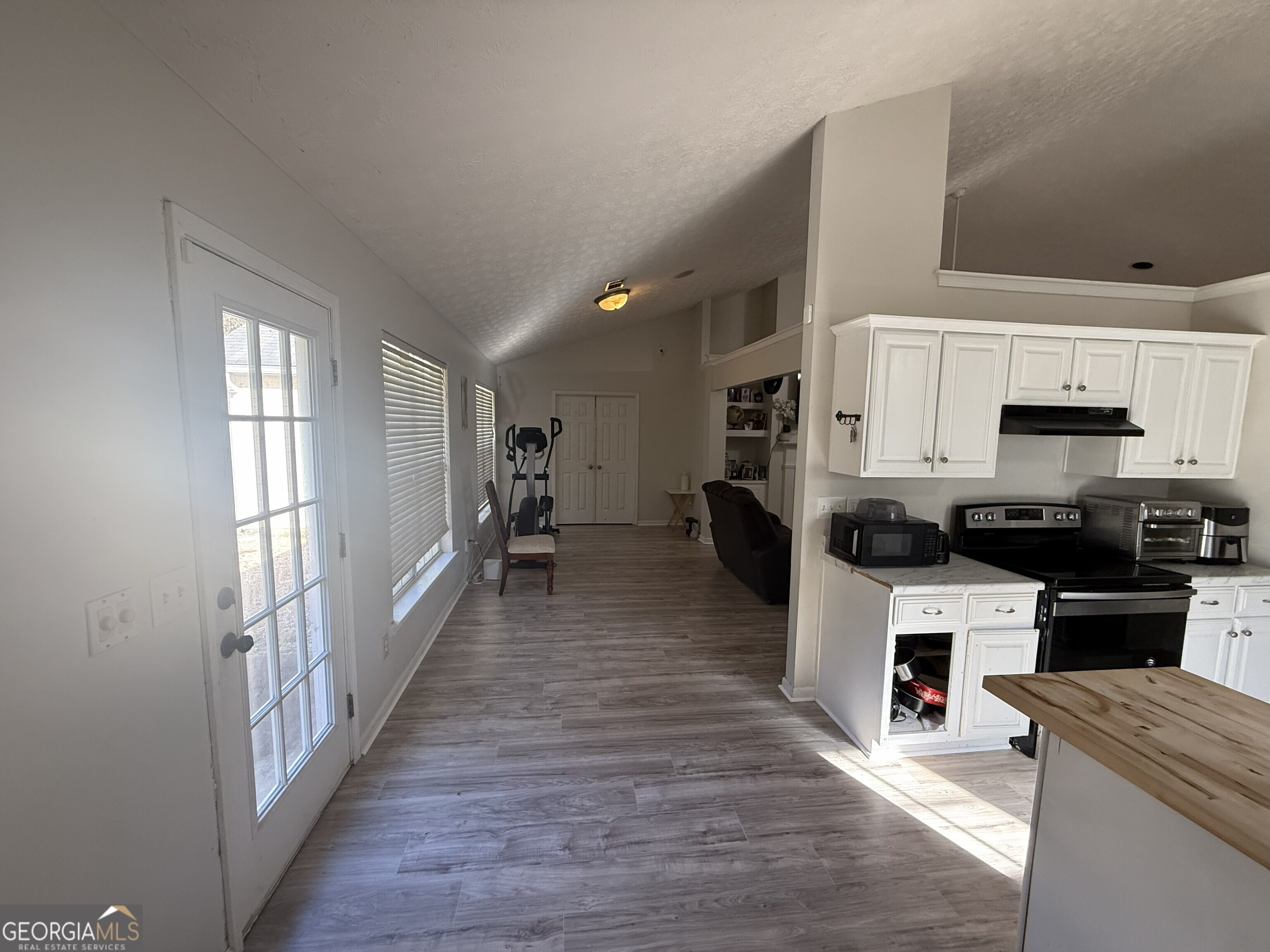 252 Sandstone Drive Hampton, GA 30228 - Photo 10 of 17 a kitchen with cabinets and wooden floor