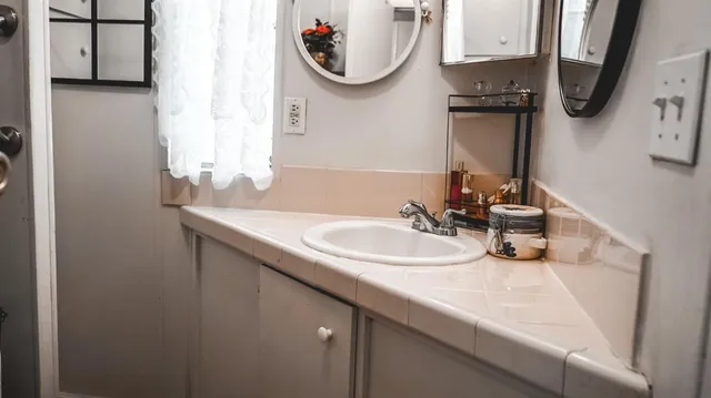 a bathroom with a sink and a mirror