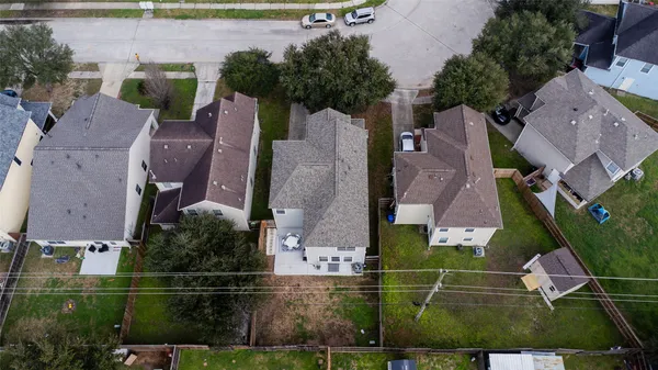 an aerial view of multiple houses with outdoor space