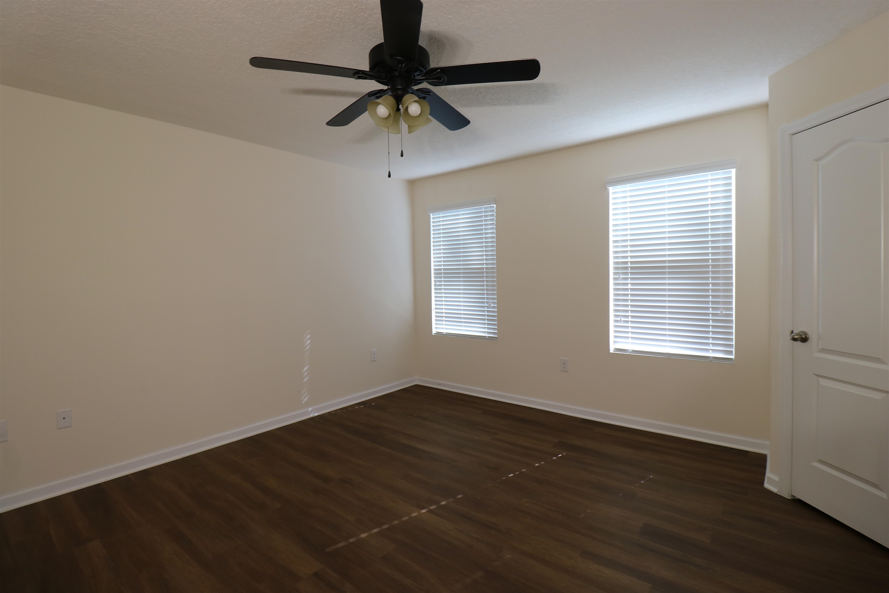 638 Servia Drive St. Johns, FL 32259 - Photo 9 of 27 a view of an empty room with wooden floor and a window