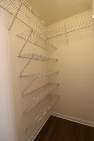 a view of a room with racks on the wall