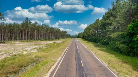 a view of swimming pool with a yard
