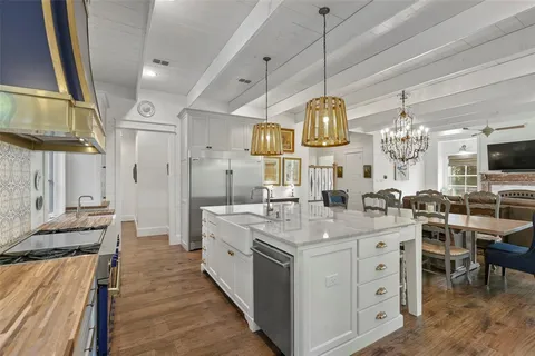 a kitchen with center island and stove