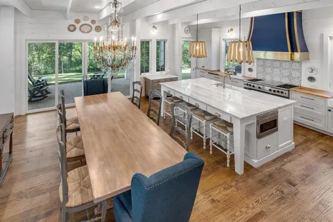 a kitchen with a stove a sink and a refrigerator