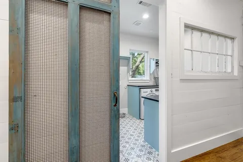 a view of a kitchen from the hallway