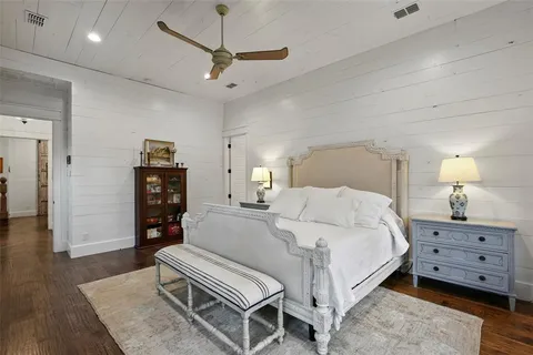 a bedroom with a bed and dresser