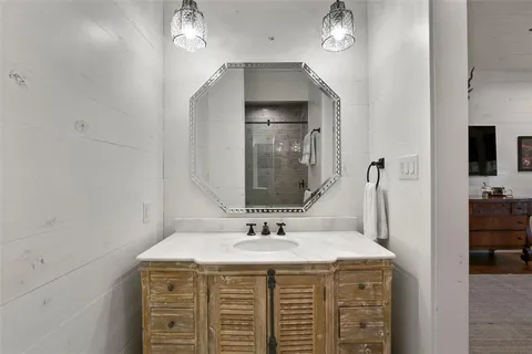 a bathroom with a sink and a mirror