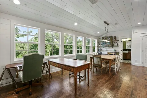 a view of a dining room with furniture window and wooden floor