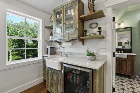 a kitchen with a sink cabinets and window