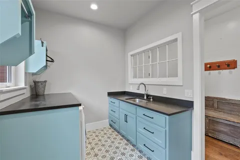 a kitchen with a sink and a window